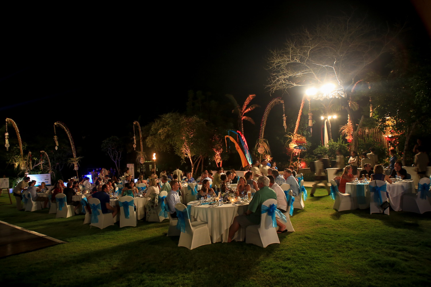 Corporate dinner guests at an outdoor event in Bali